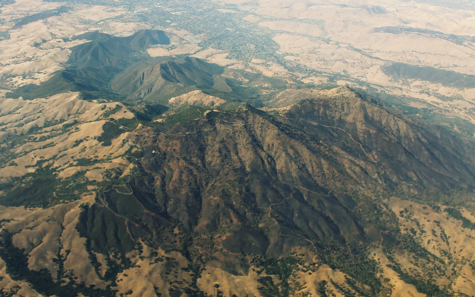 An aerial view of Mount Diablo and surrounding open space, showing the distinctive peak and rolling landscape near Danville